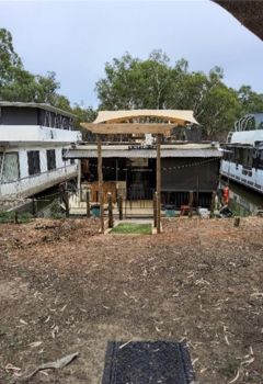 The elderly man's houseboat with access repaired and restored